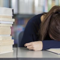 Female college student tired from studying