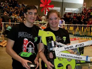 Elsie Becker and her brother Dirk holding their robot.
